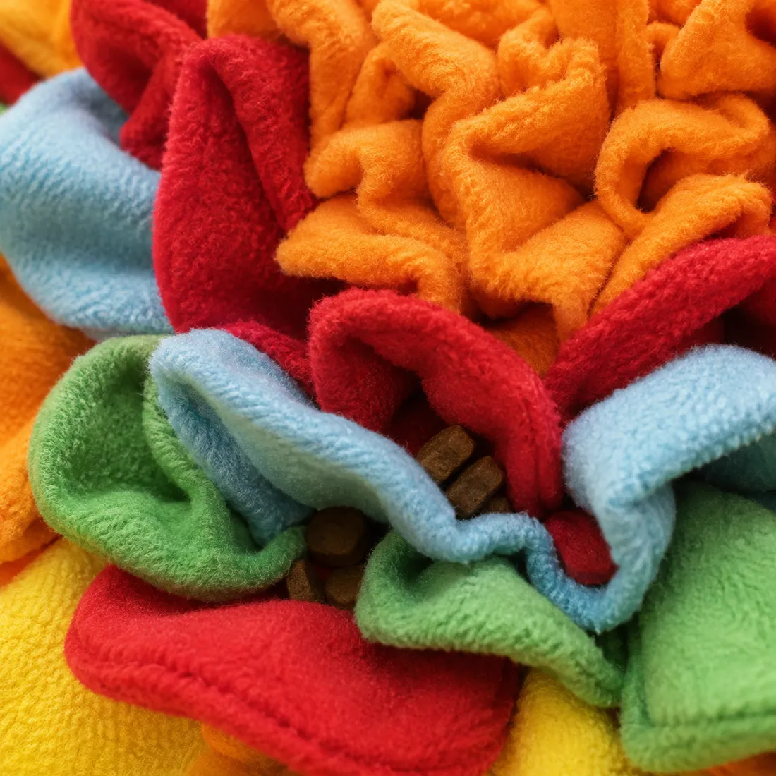 Macro close-up of the dense fleece petals, showing how deep the folds are and how kibble disappears between the layers